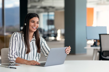 Happy smiling woman working in call center