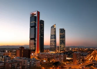 Fotobehang 4 towers business center Madrid at sunset © tavi004