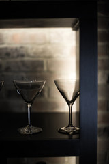 Martini glasses on backlight shelf