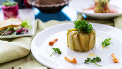 salad in pickles with mushrooms on a white plate