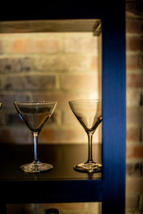 Martini glasses on backlight shelf