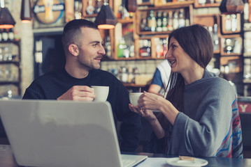 Young couple have fun and enjoying in cafe