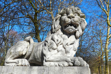 Terrified looking lion, sculpture by Joseph Dubois, 1780, at the gate of the Brussels Park (Parc de...