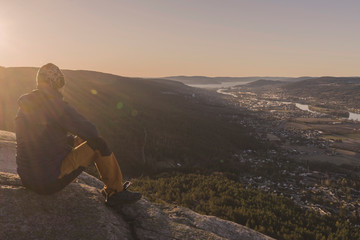 Fototapeta premium Sitting on the rock and watching morning view.