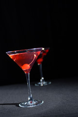 Red cocktail in martini glass