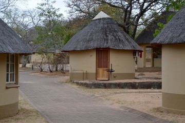 Fototapeta na wymiar Thatched huts in Pretoriouskop rest camp in Kruger Park