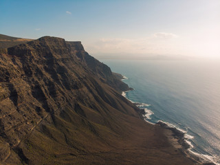 Aerial shot of cliffs in north of Lanzarote, Canary Islands at sunset