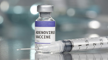 Adenovirus vaccine vial in lab with syringe