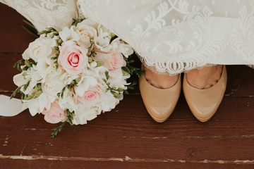 wedding bouquet of roses and shoes