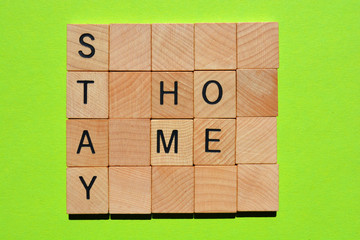 Stay Home, words in wooden alphabet letters 