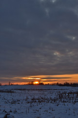 colorful sunset over a snow-covered field
