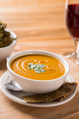 Vegetable soup with parsley rustic table with spoon 