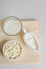 Homemade fermented drink in a glass of kefir, cottage cheese on a white background, copy space, top view.