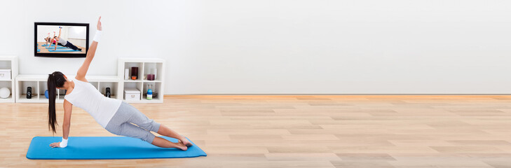 Woman practising yoga at home