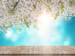 3D wooden table looking out to a cherry blossom tree on a blue sky background
