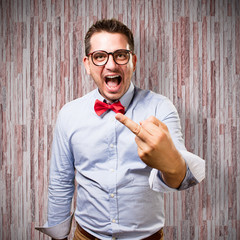 Man wearing a red bow tie. Rocker gesture.