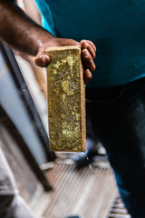 Craftsman melting gold in a foundry, creating gold bars / ingots in Istanbul, Turkey
