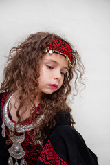 Arabian adorable girl in bedouin traditional cloths 