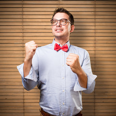 Man wearing a red bow tie. Looking succesful.