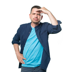 Young man wearing a blue outfit. Looking tired.