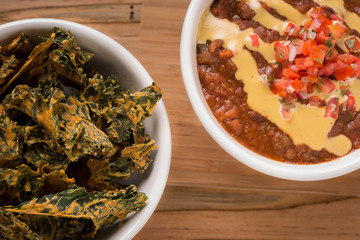 Vegetable Chili with pico de gallo and spoon on the side