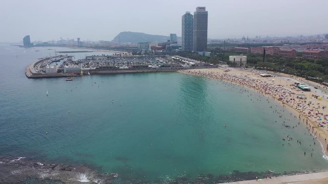 BARCELONA, SPAIN - JULY 07, 2019: Aerial panoramic view of modern Barcelona cityscape on Mediterranean coast 