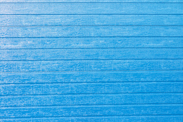 Wooden textured background for design with blue planks. Front view with copy space.