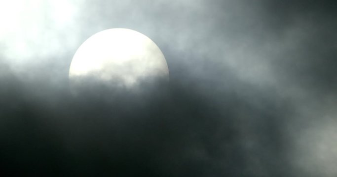 Sun covered with dark clouds, Compton Abbas, Dorset, UK