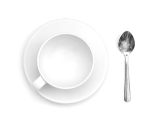 White empty coffee cup with spoon, top view isolated on white background.