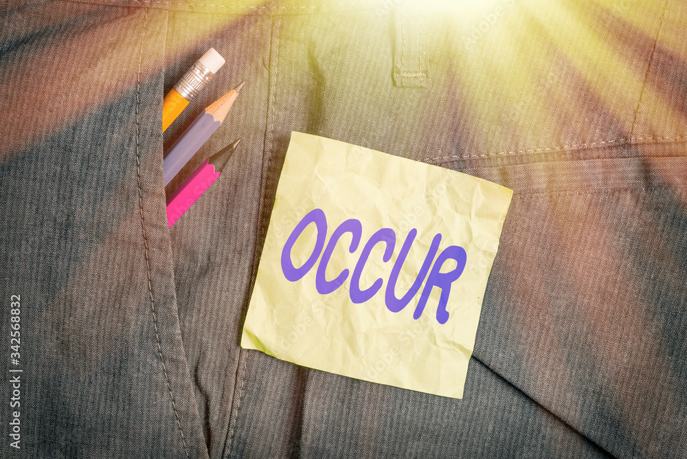 Wall mural Conceptual hand writing showing Occur. Concept meaning especially of accidents and other unexpected events to happen Writing equipment and green note paper in pocket of trousers