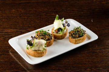 Italian appetizer on black slate background. Crusty bruschetta Delicious and healthy restaurant meals, copy space