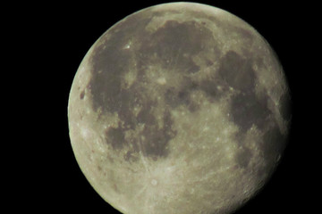 The moon in the dark sky close plan