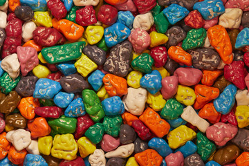 Fototapeta na wymiar Colorful chocolate candy stones background