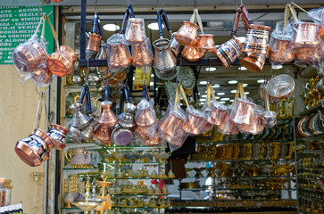 Several Turkish Coffeepots from copper and tin hanging on a street stall in Eminonu Bazaar of Istanbul.