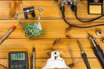 Tools for repairing phones, tablets and electronic equipment with copy space on a wooden...
