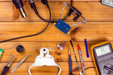 Tools for repairing phones, tablets and electronic equipment with copy space on a wooden...