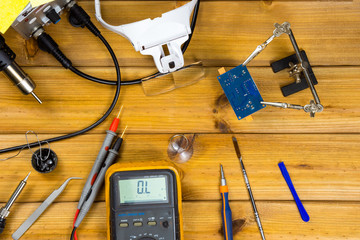 Tools for repairing phones, tablets and electronic equipment with copy space on a wooden...