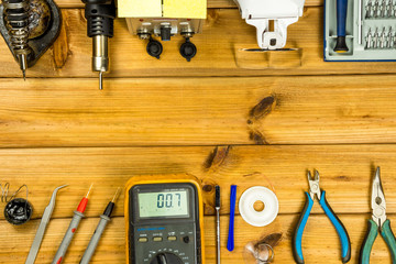 Tools for repairing phones, tablets and electronic equipment with copy space on a wooden...