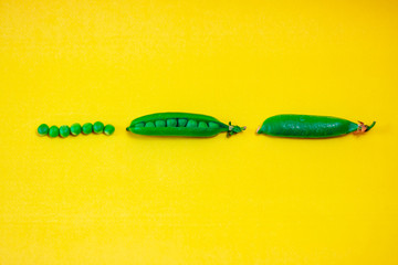 green peas extracted on yellow background