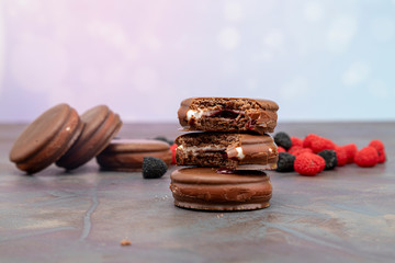 Chocolate covered macaroon with marshmallow and cherry extract inside