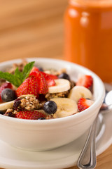 Granola with fresh strawberries, blueberries, and bananas