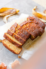 Banana Bread with Ingredients on Grey Background