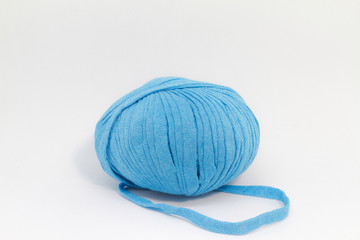 Blue wool ball for knitting on white background.