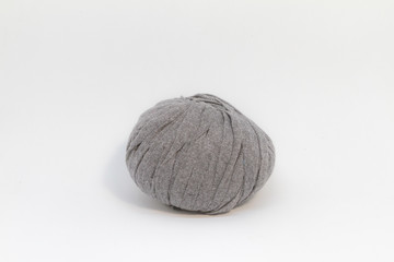 Brown wool ball for knitting on white background.