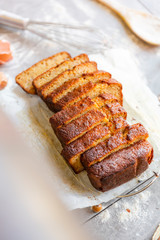 Banana Bread with Ingredients on Grey Background