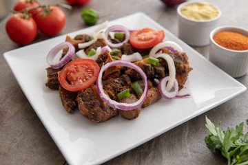 African national dish. Nigerian meal. Healthy lifestyle dish with red onions tomatoes. Salad dish. 