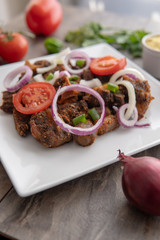 African national dish. Nigerian meal. Healthy lifestyle dish with red onions tomatoes. Salad dish. 
