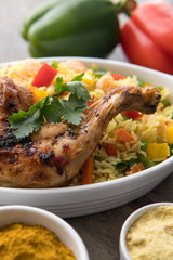 Grilled chicken with red onions. African food meal. Nigerian national dish. Fresh and healthy with tomatoes and red onions. Fried food. Fresh salad with peppers Cuisine