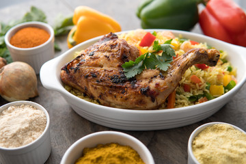 Grilled chicken with red onions. African food meal. Nigerian national dish. Fresh and healthy with tomatoes and red onions. Fried food. Fresh salad with peppers Cuisine