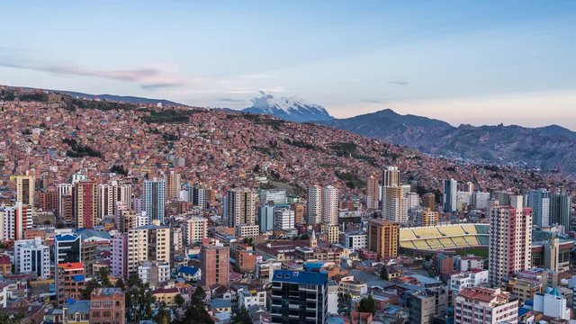 La Paz, Bolivia, day to night timelapse view of cityscape and Illimani mountain.